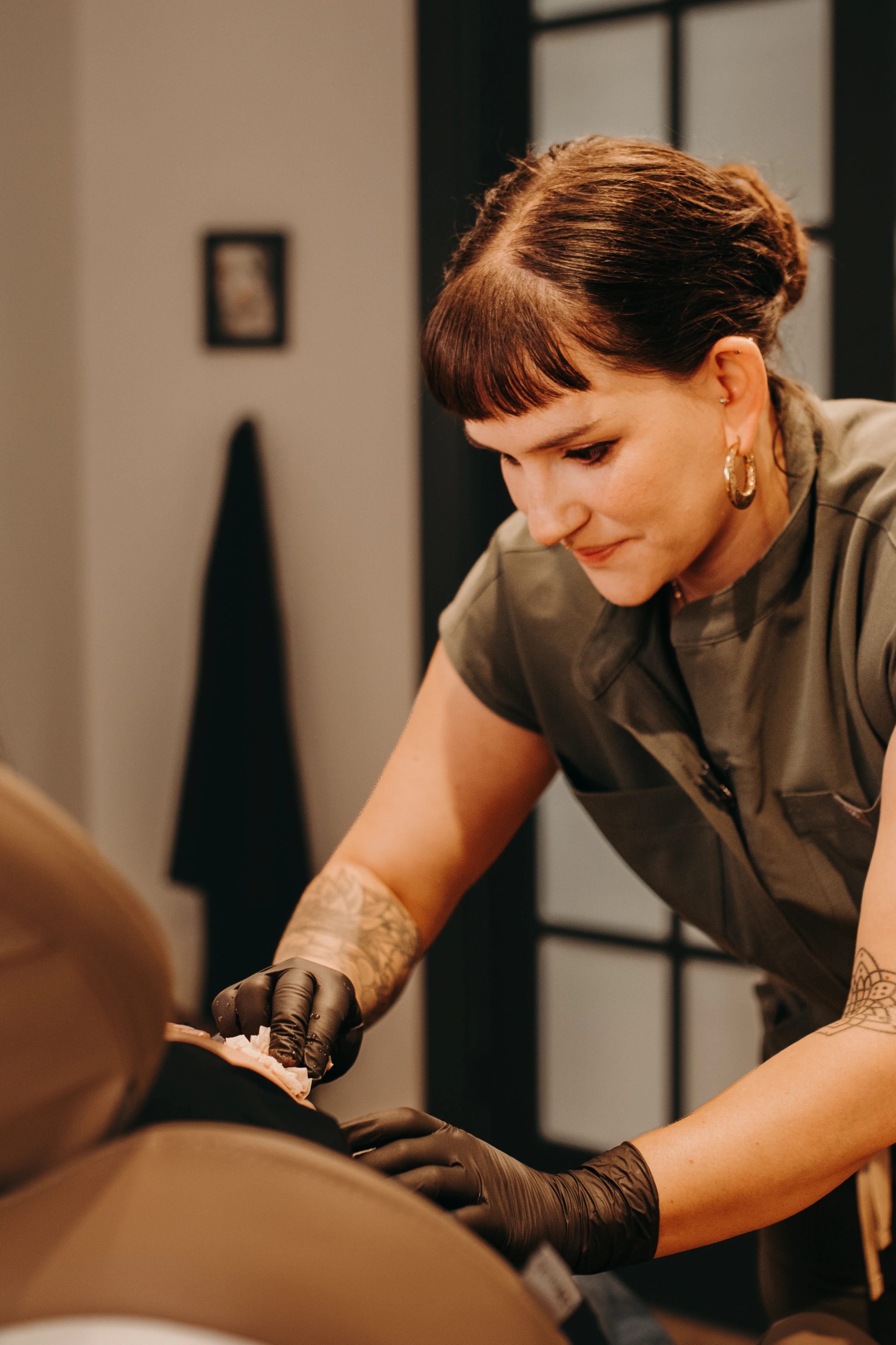 Danielle Payne working attentively with a client