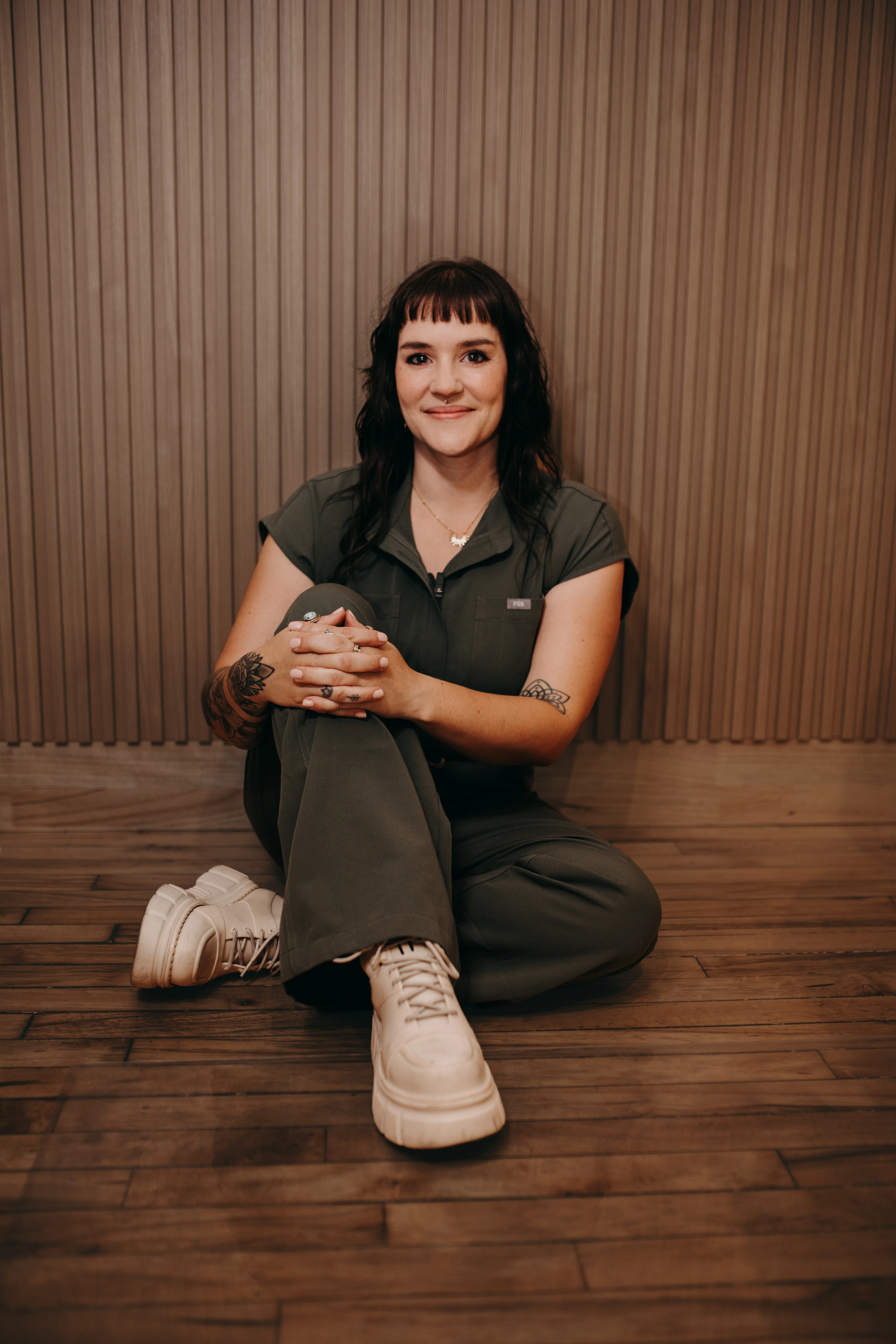 Danielle Payne seated in the SKIN studio
