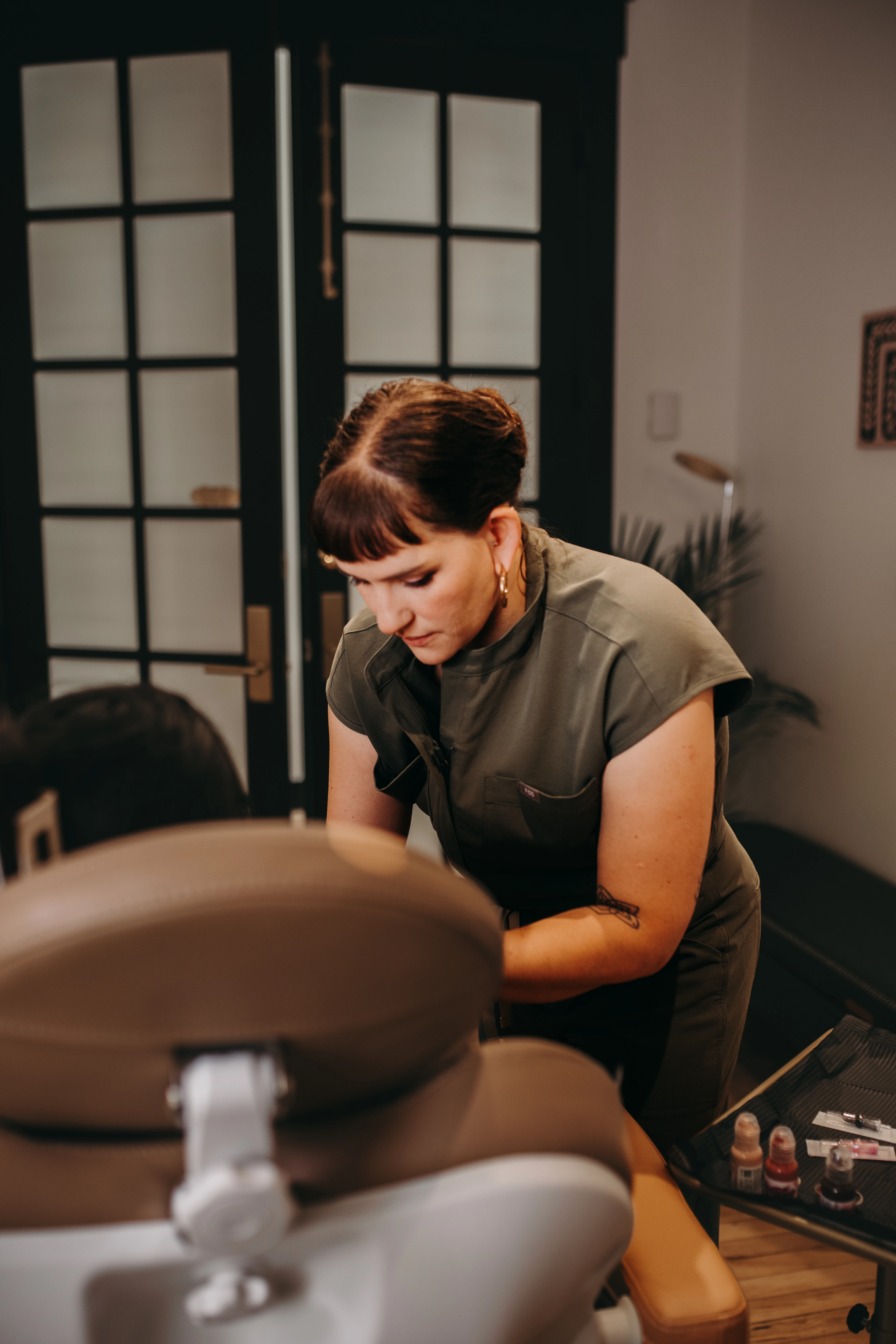 Danielle Payne focused on a saline tattoo removal treatment